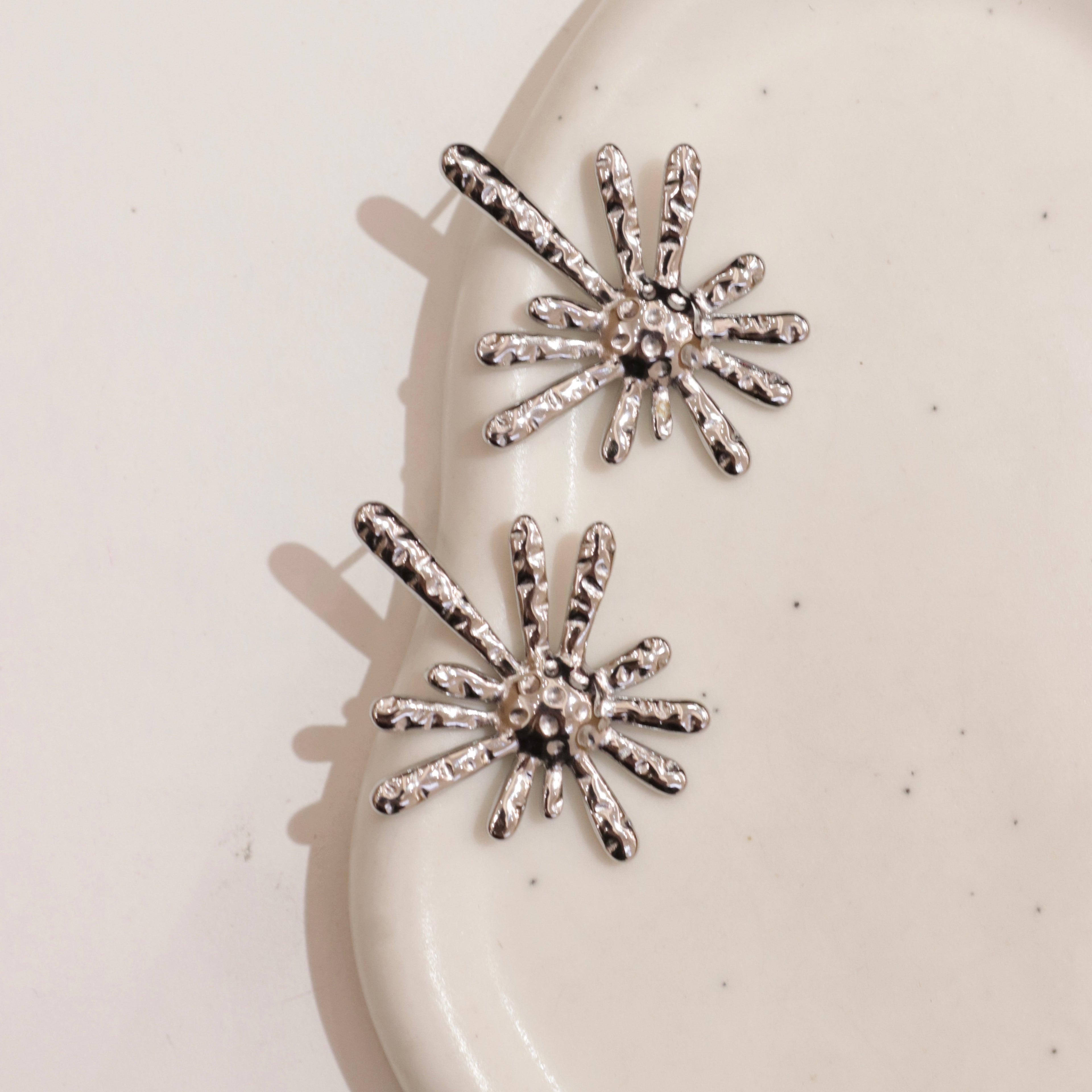 Orecchini raggi astratti