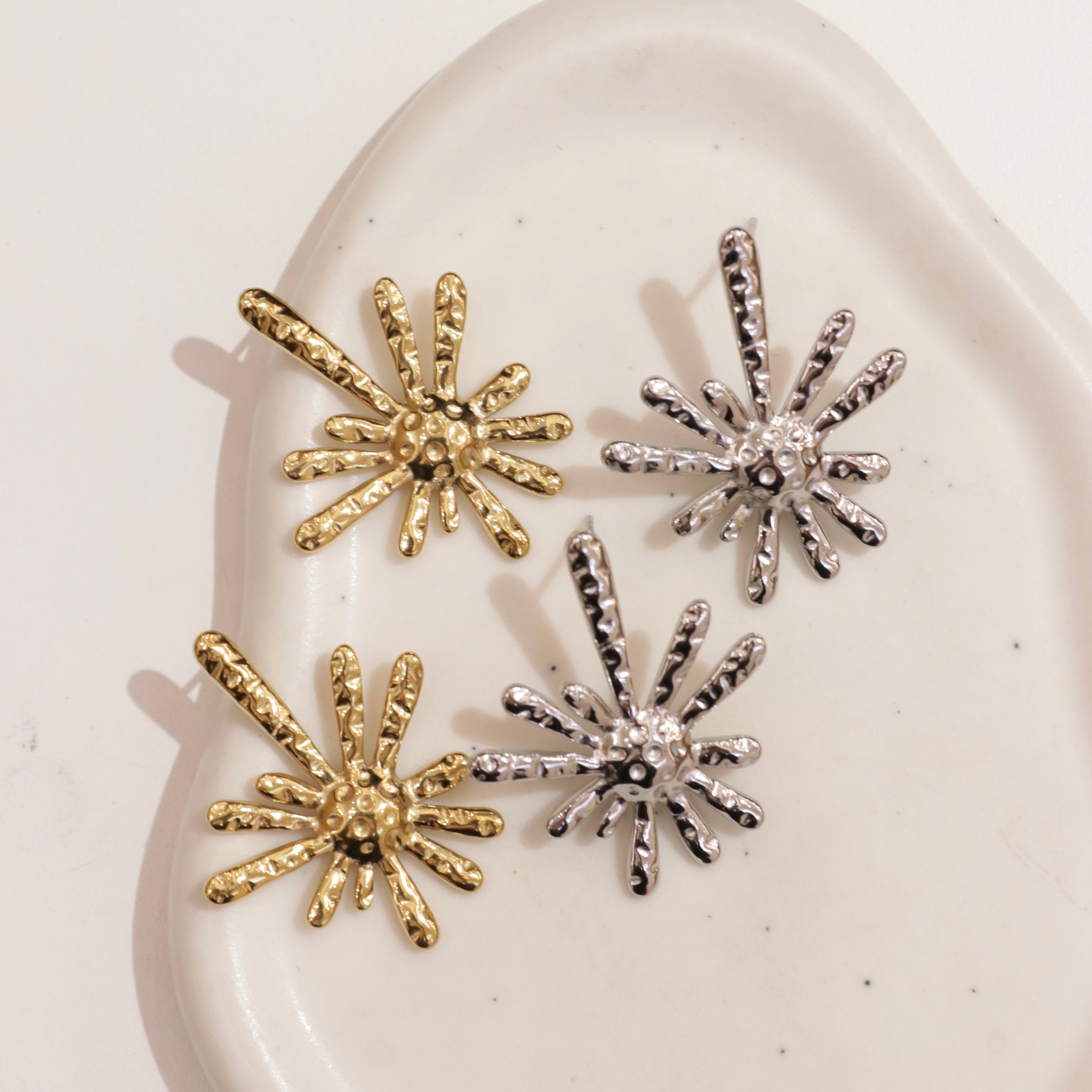 Orecchini raggi astratti