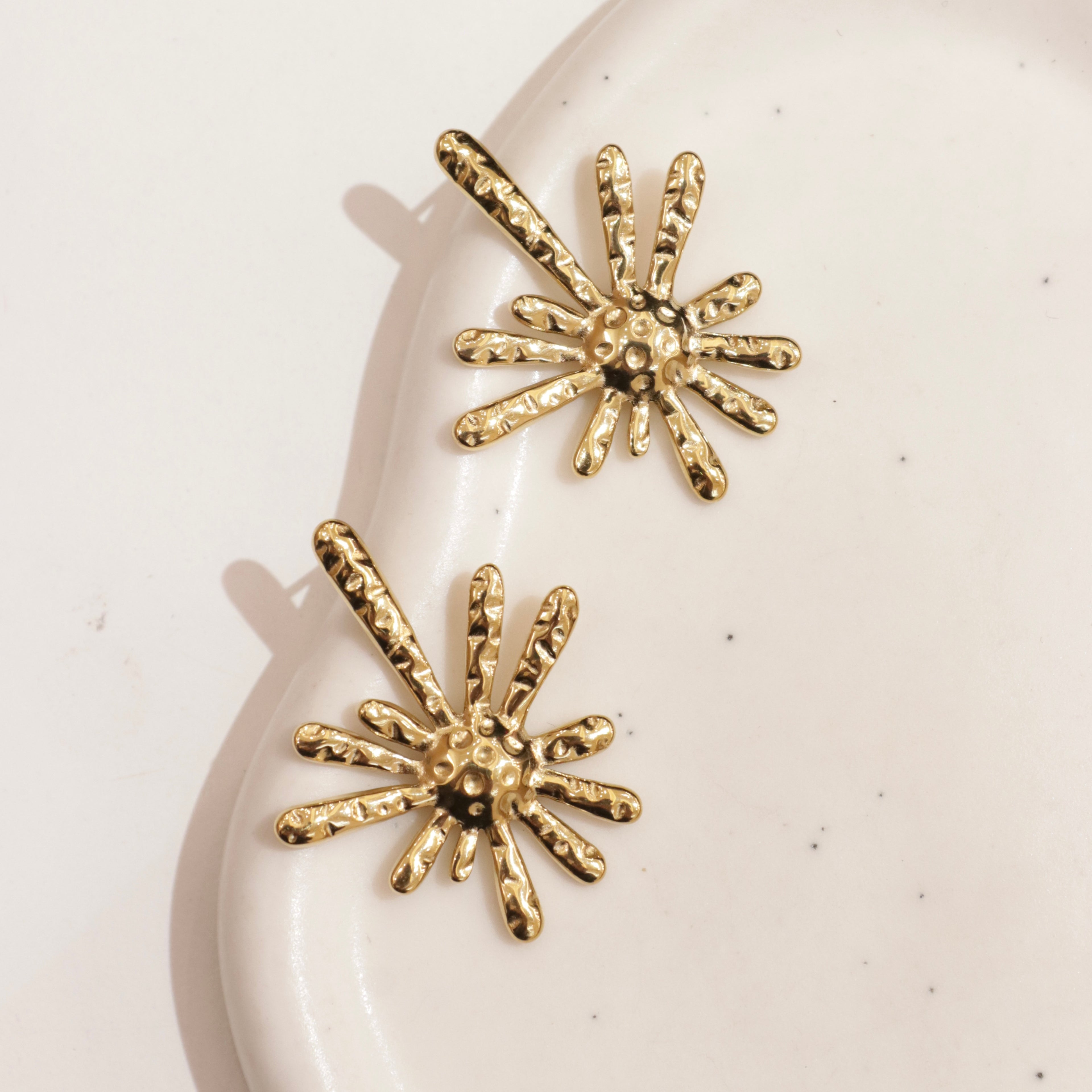 Orecchini raggi astratti